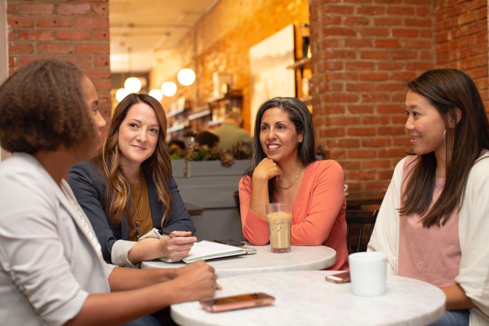 women chatting over coffee